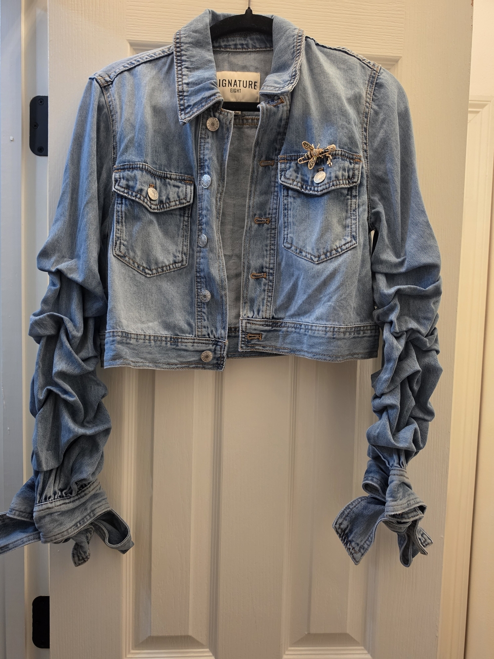 Signature Light Blue Cropped Denim Jacket with Ruched Tie Sleeves